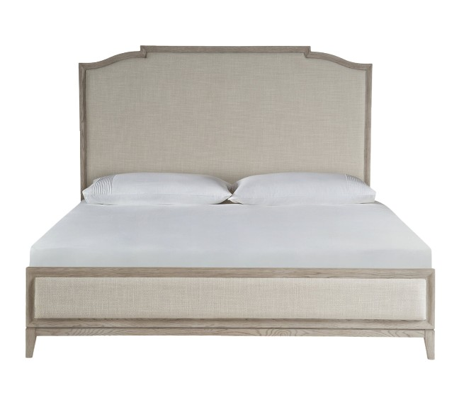Cream upholstered bed with wood trim and slightly scalloped headboard traditional home furniture