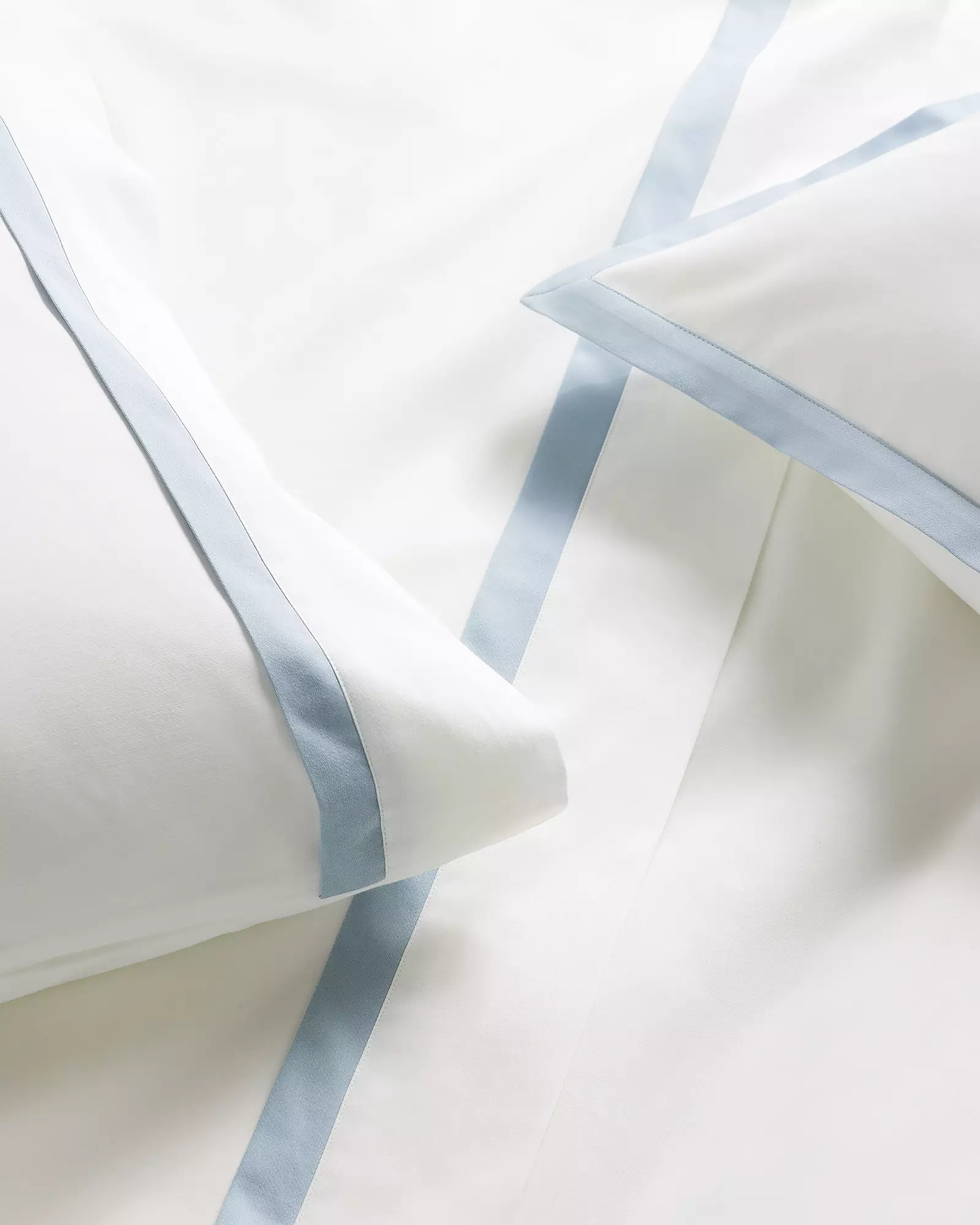 White duvet cover with light blue trim traditional coastal home decor